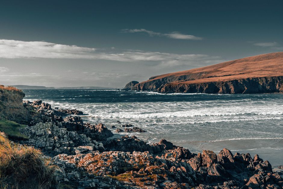 Stunning view of Ireland's Atlantic coast with dramatic cliffs and ocean waves.