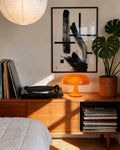Black-framed abstract ink wall art with bold brush strokes and cross lines
