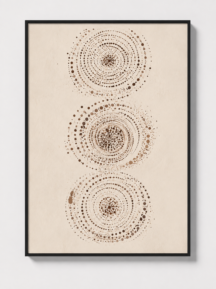 Abstract wall art in black frame featuring three dotted circular mandalas