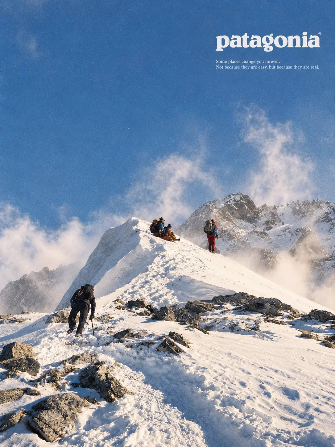 Snow Peak mountain wall art print with hikers on snowy ridge, Patagonia logo