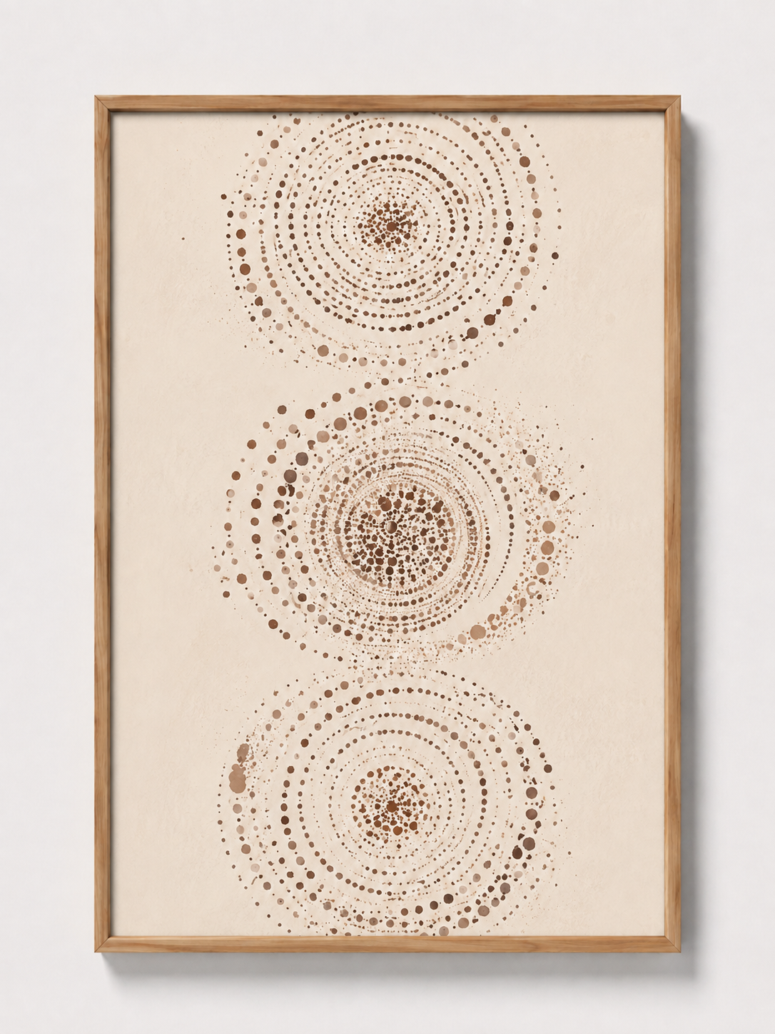Abstract wall art print in light wood frame with three dotted concentric circles