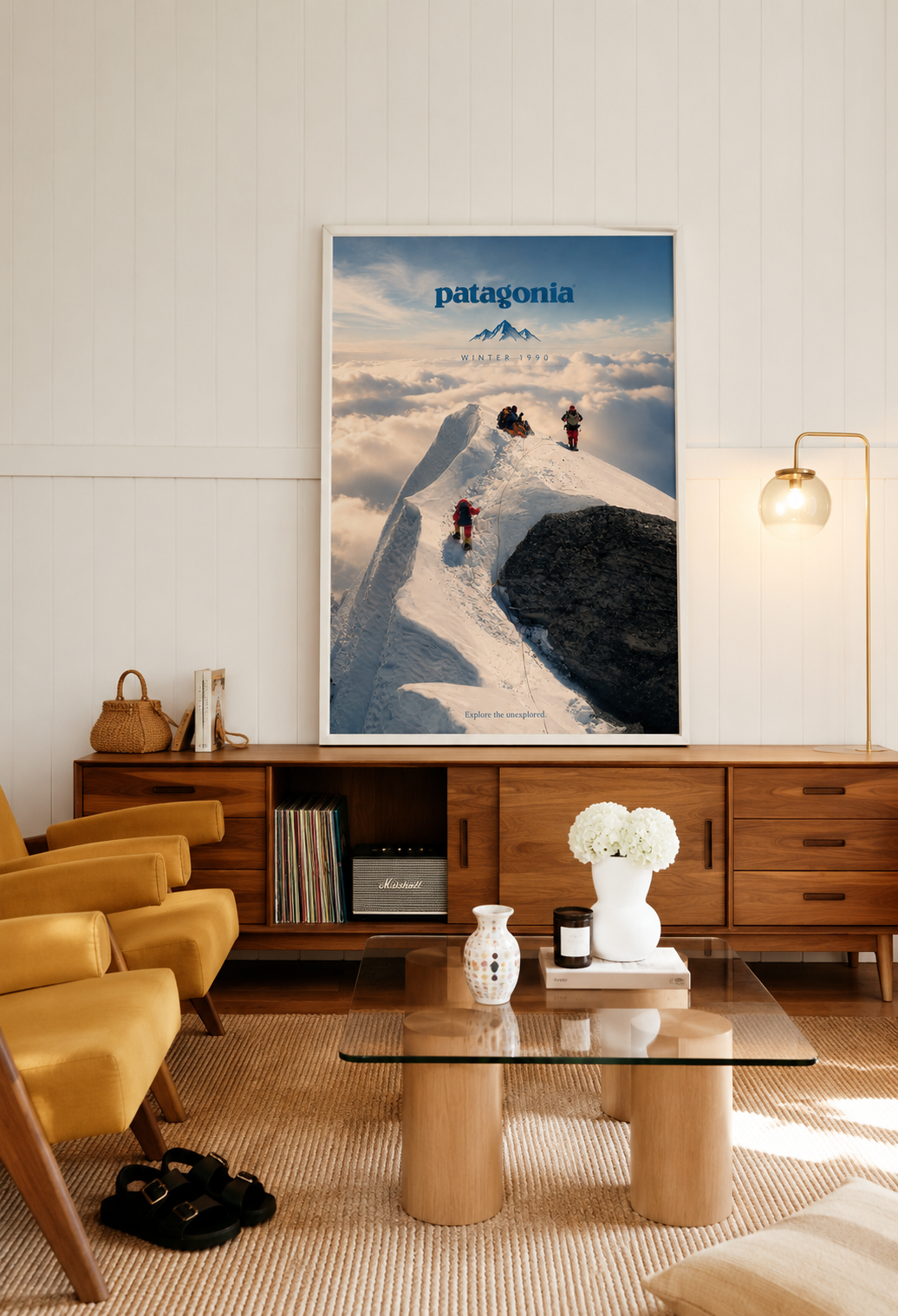 Framed Patagonia Mountain Ridge print against wall with snowy ridge climbers