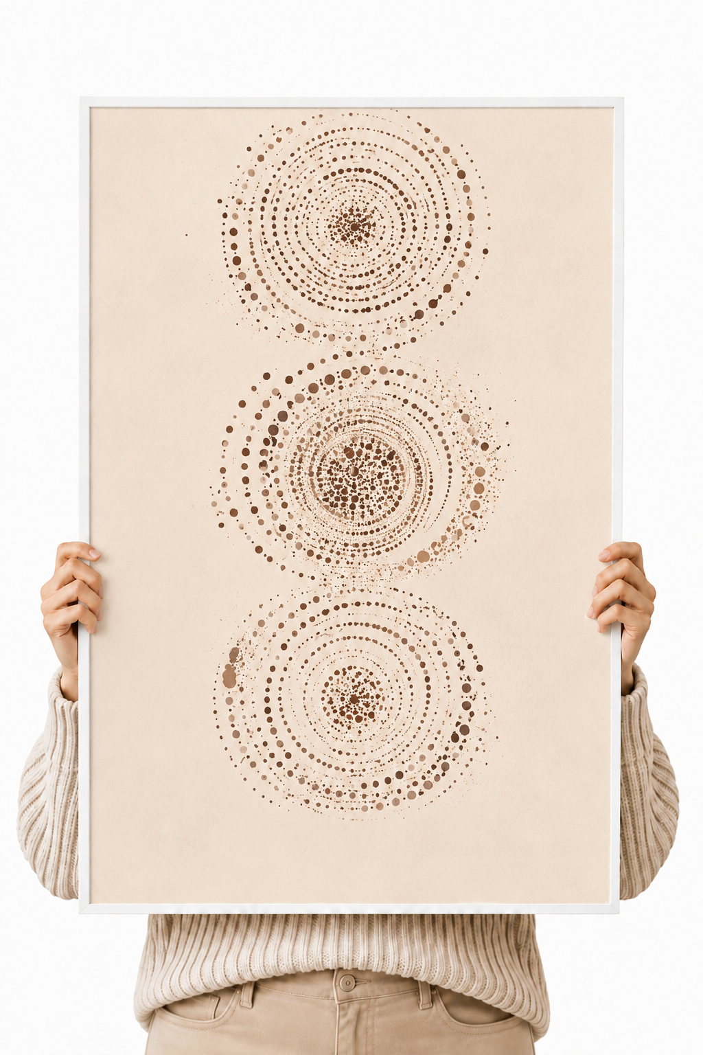 Frameless abstract wall art poster held up, showing three dotted circular motifs
