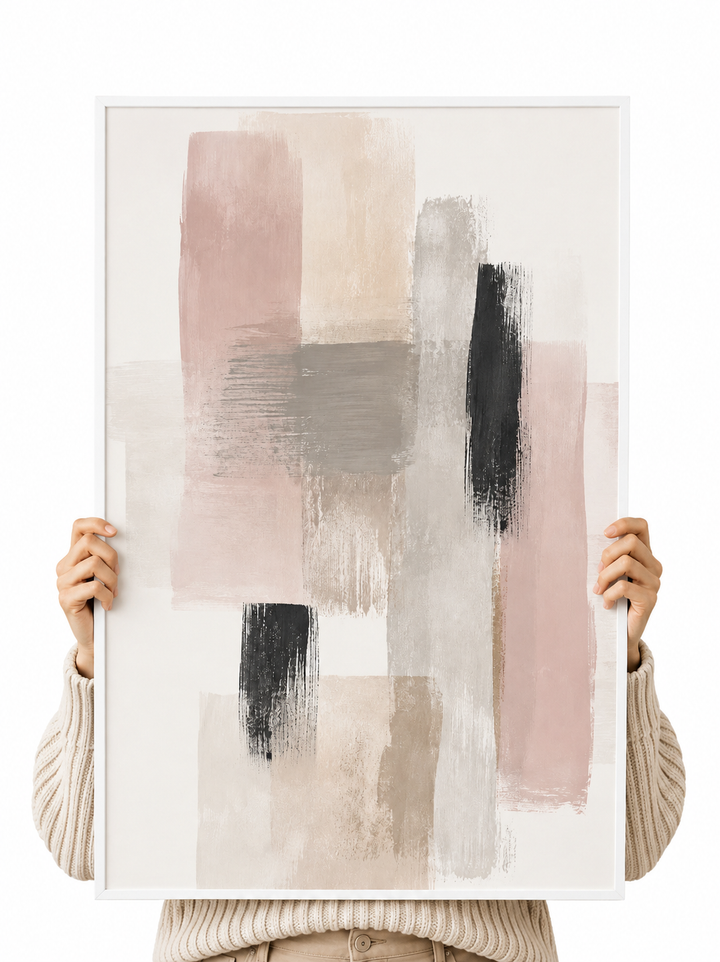 Abstract paper poster with beige, gray, and black brush-stroke rectangles, held by hands