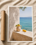 Mediterranean sea view wall print with vase, lemons, and stone ledge