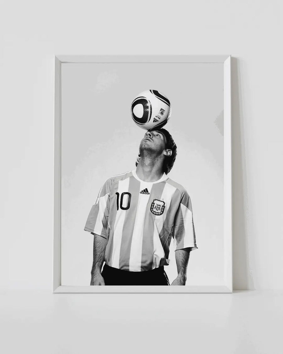 Framed white Argentina No.10 jersey poster with Messi and ball above head (black and white)