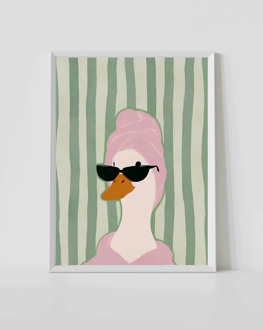 White-framed duck wall art poster with pink duck wearing black sunglasses, green stripes