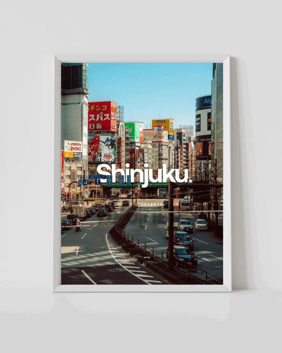 Framed Shinjuku travel poster print with city street scene and bold 'Shinjuku' text