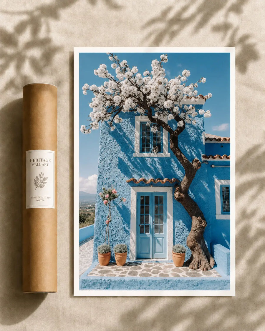 Framed cottage print with blooming tree and blue house facade, white windows