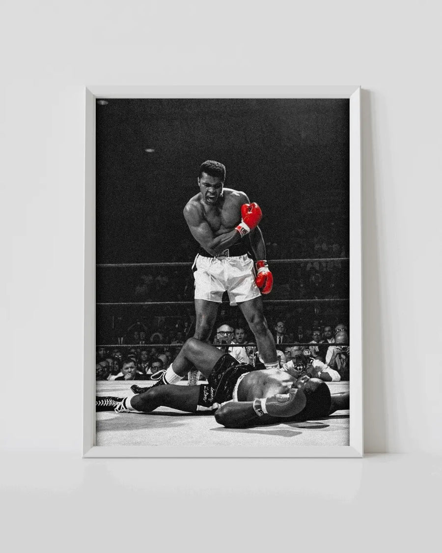 White-framed boxing poster with monochrome Ali throwing punches, red gloves