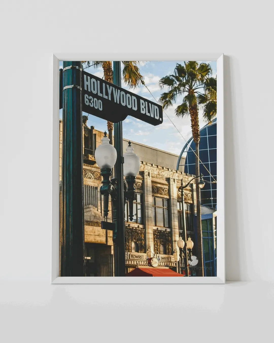 White-framed wall art featuring Hollywood Blvd sign and street lampposts