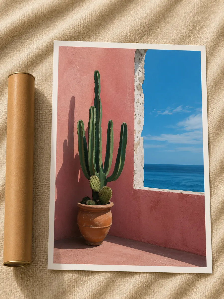 Cactus print with green potted cactus against pink wall and blue window