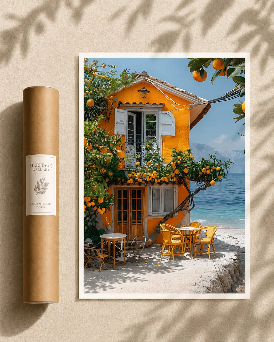 Orange grove house print wall art with orange facade, windows, and patio chairs by the sea.