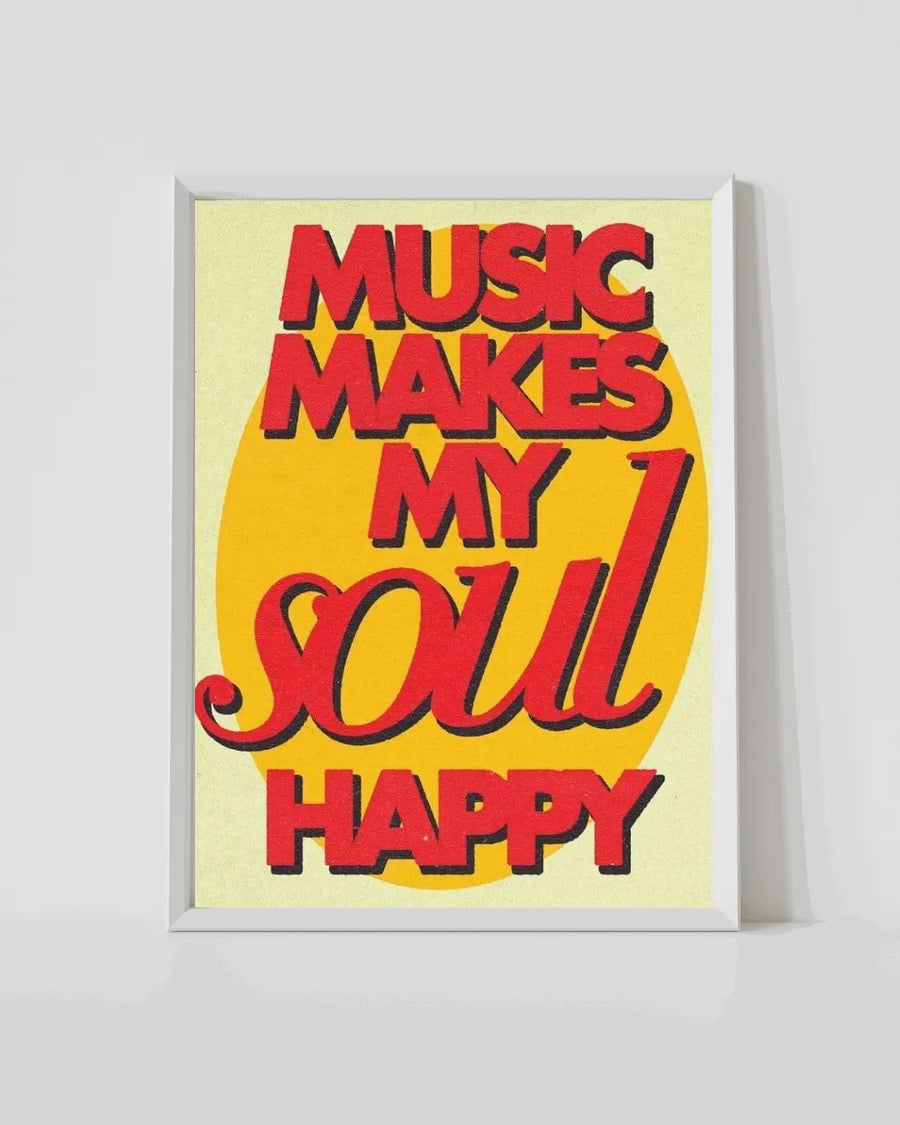 Framed music quote print with yellow background, red lettering, and white frame.