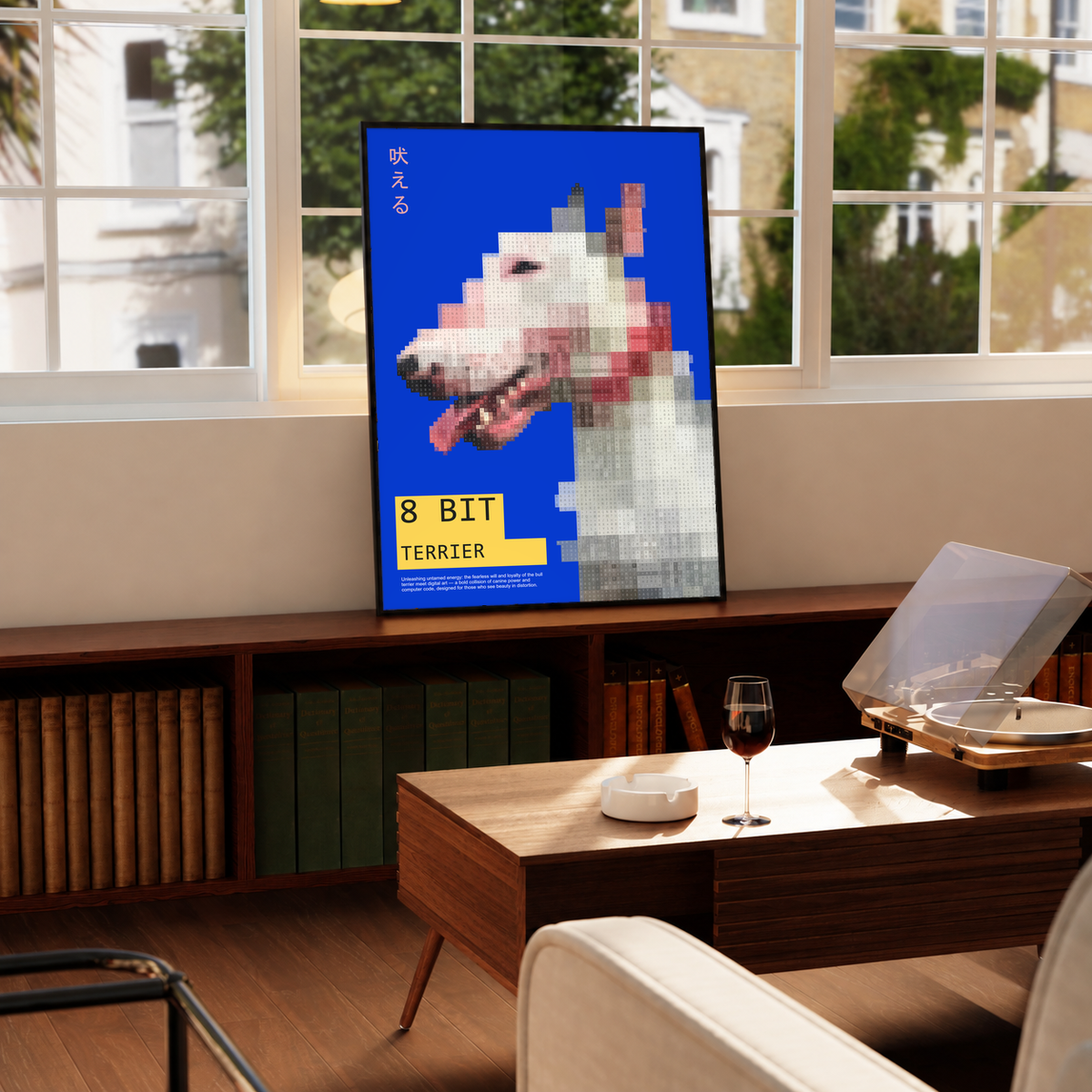 Pixelated white terrier head with yellow 8 Bit Terrier label on blue; framed print beside a window