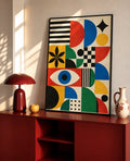 Framed Bauhaus-style abstract art print with black border and geometric color blocks.
