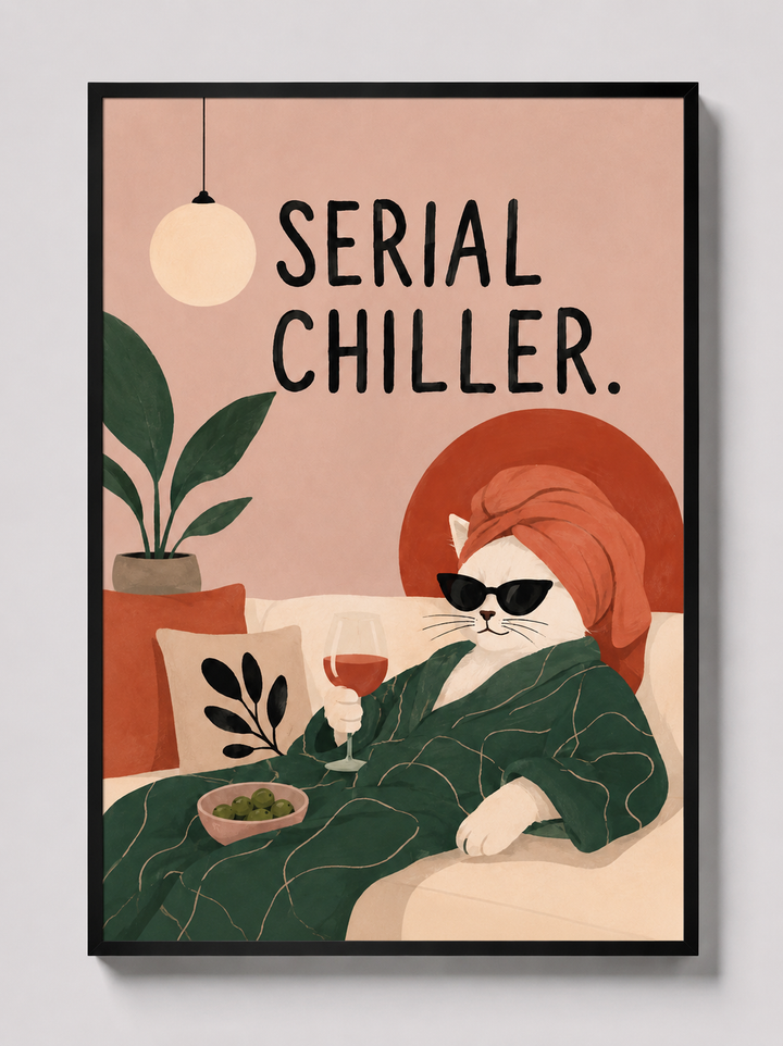 Black-framed cat art print featuring an orange cat, green table scene, and “Serial Chiller”