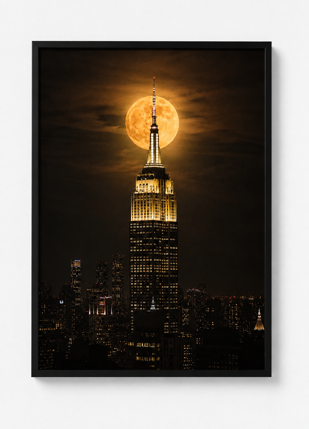 Modern New York wall art featuring the Empire State Building and a glowing full moon captured in a dramatic night scene.