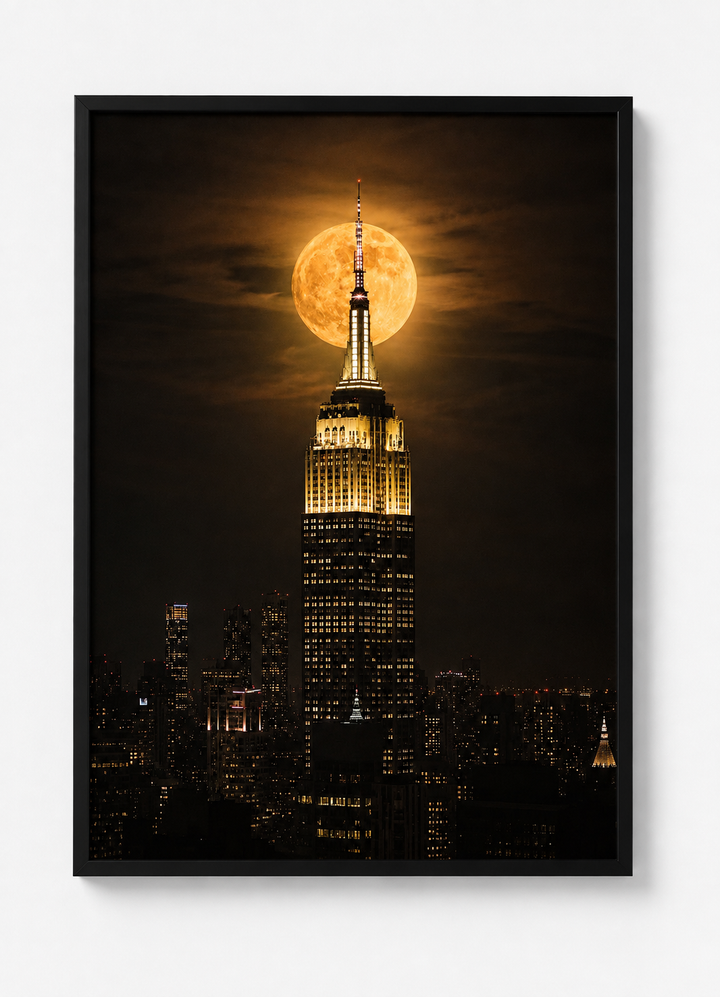 Modern New York wall art featuring the Empire State Building and a glowing full moon captured in a dramatic night scene.