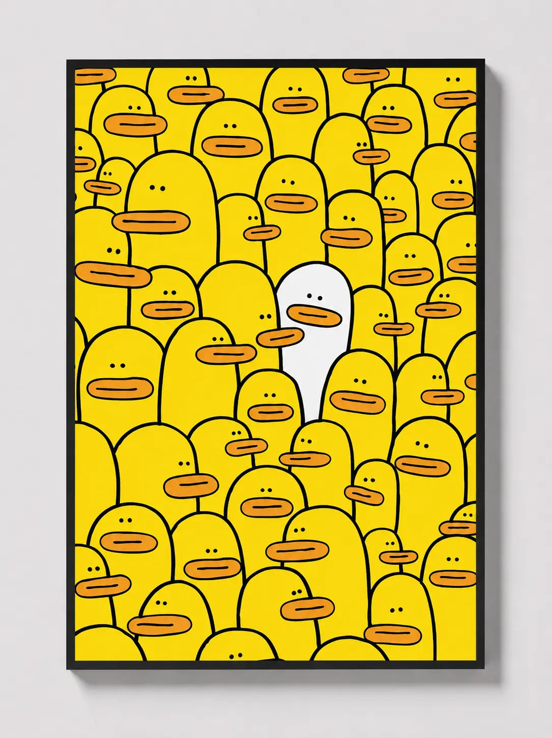 Yellow character-face graphic wall art in a black frame.