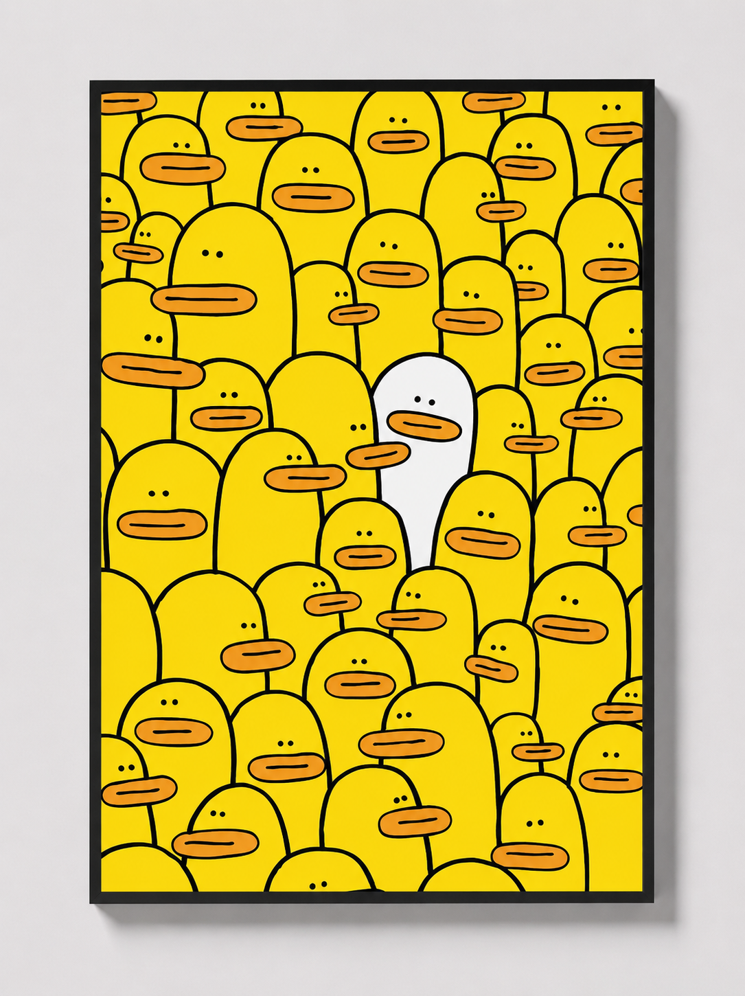 Yellow character-face graphic wall art in a black frame.