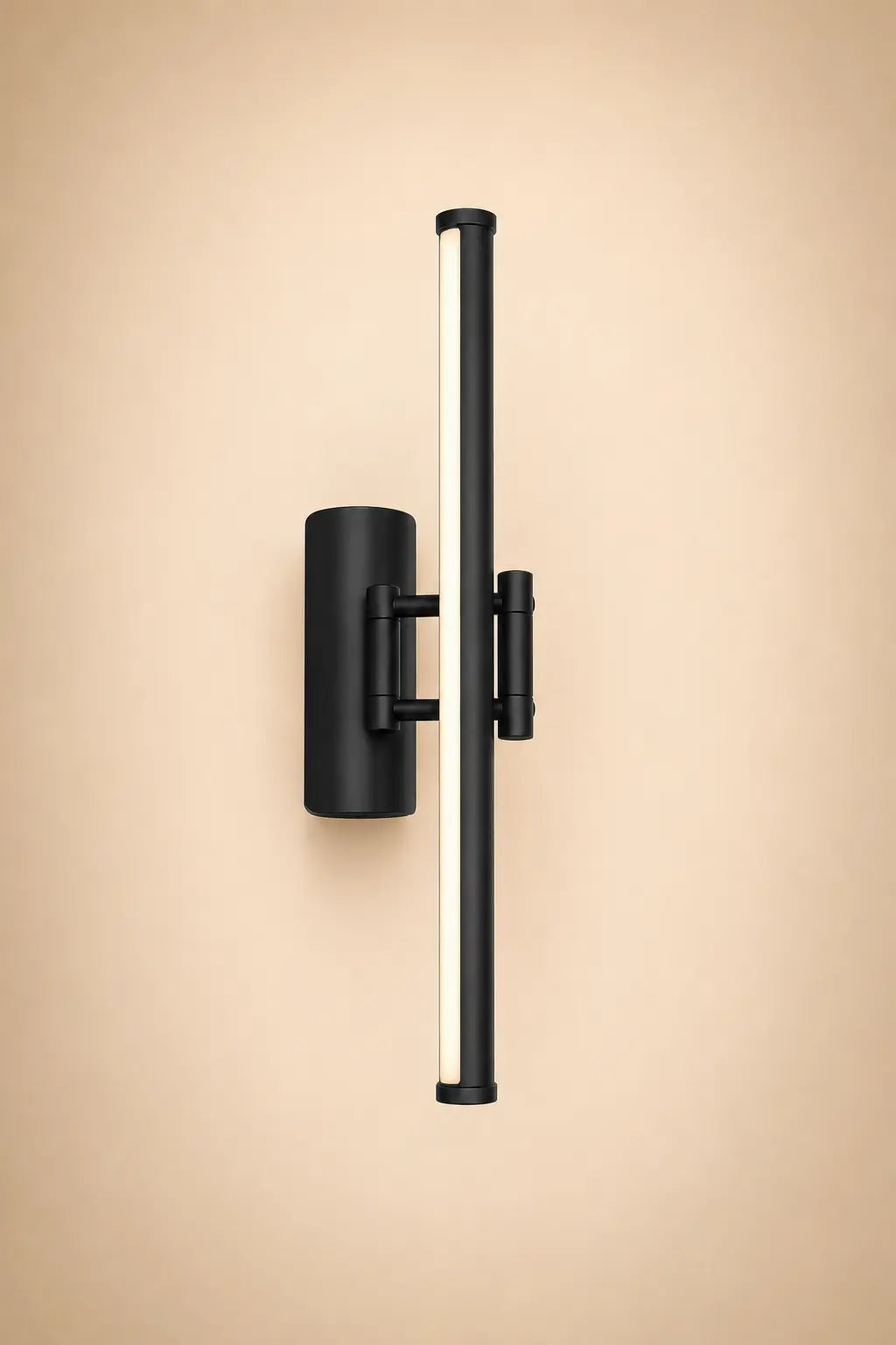 Black and gold wall sconce light with vertical bar and cylindrical shades