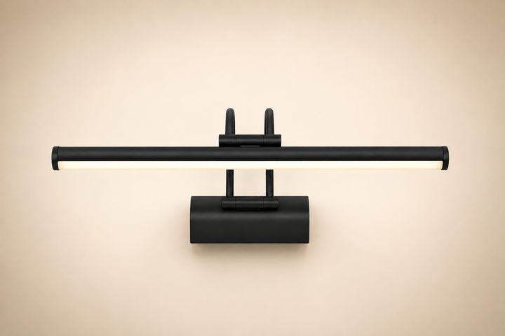 Black Wall Art Light softly illuminates a framed print and creates a warm dining room atmosphere.