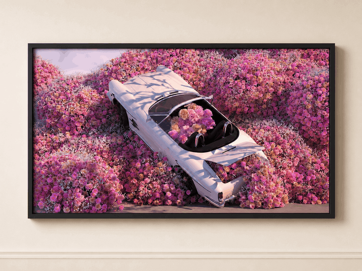 Framed floral wall art featuring light-blue car on pink flower background