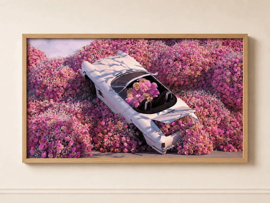 Wood-framed floral wall art featuring light-blue car among pink flowers