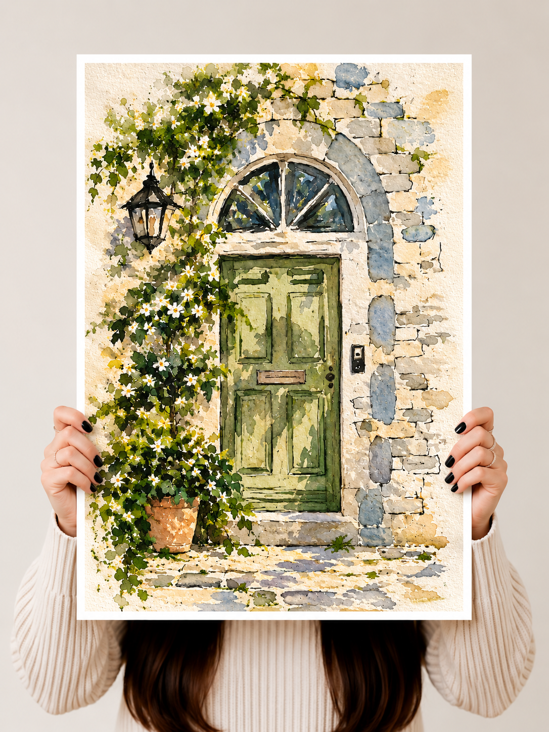 Mediterranean Door Watercolor Art Print held upright to reveal weathered stonework, trailing greenery and delicate floral details