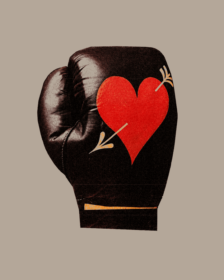 Boxing love print close-up: black boxing glove with red heart and arrow detail