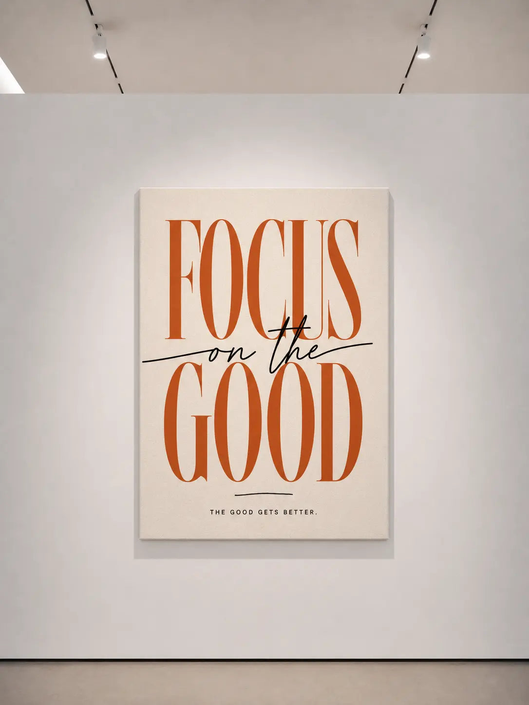 Wall art print with thin border showing “FOCUS on the GOLD” rust typography on light background