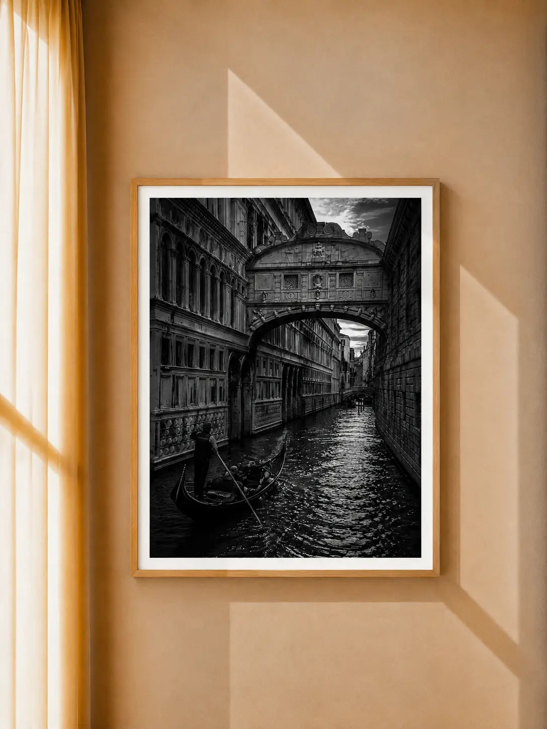 Black-framed black-and-white architecture art print with arched bridge and canal gondola