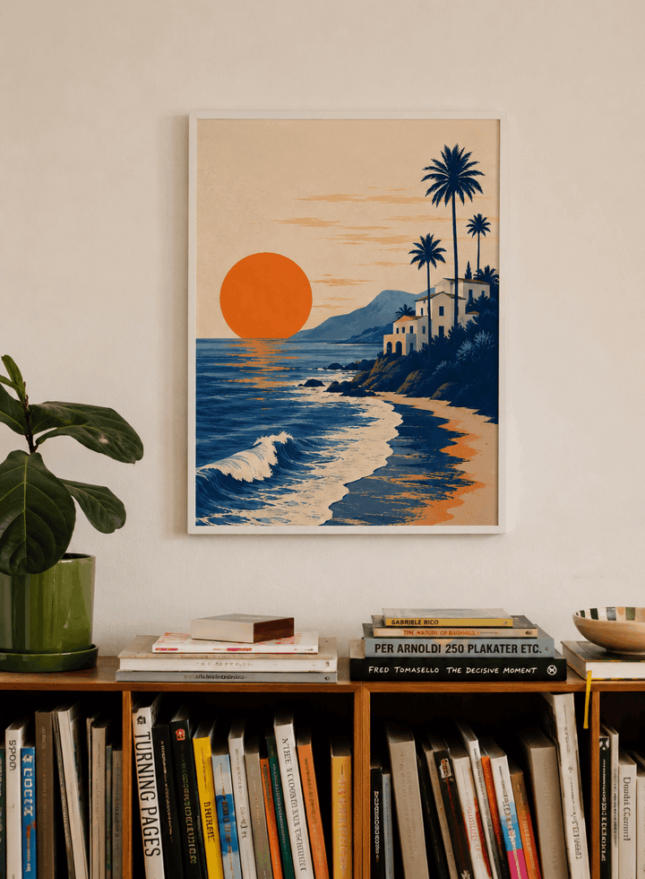 Framed beach poster with orange sun, waves, hillside houses, and tall palm trees