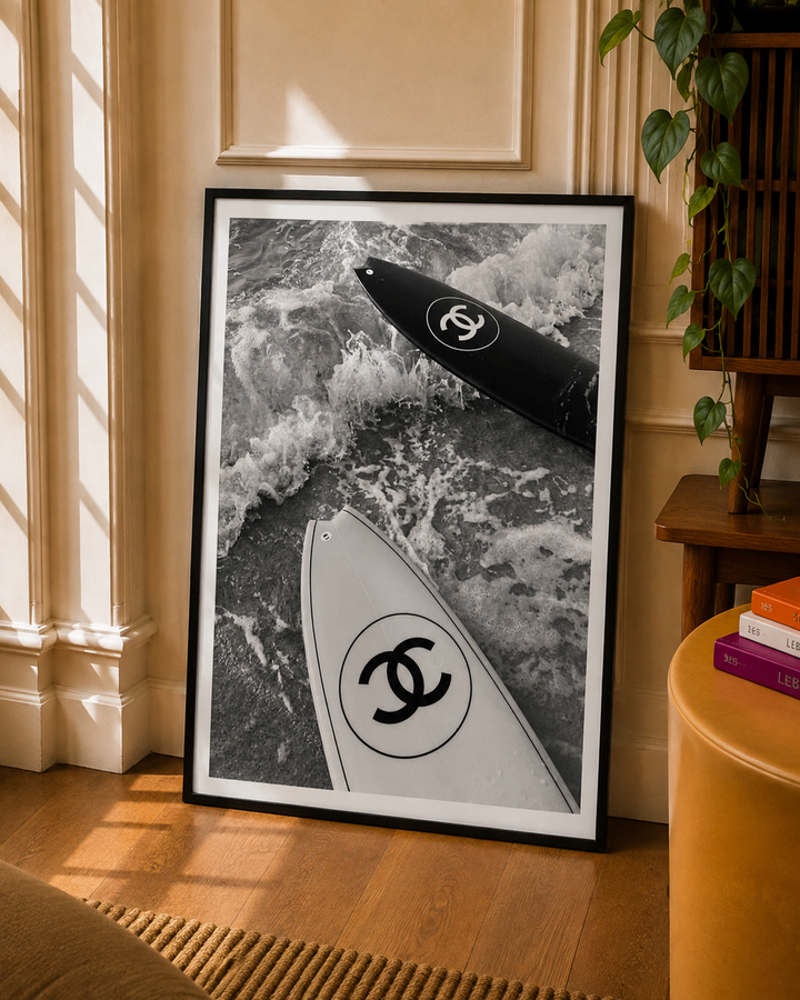 Surfboard Art Print capturing a surfboard surrounded by textured ocean waves in black and white