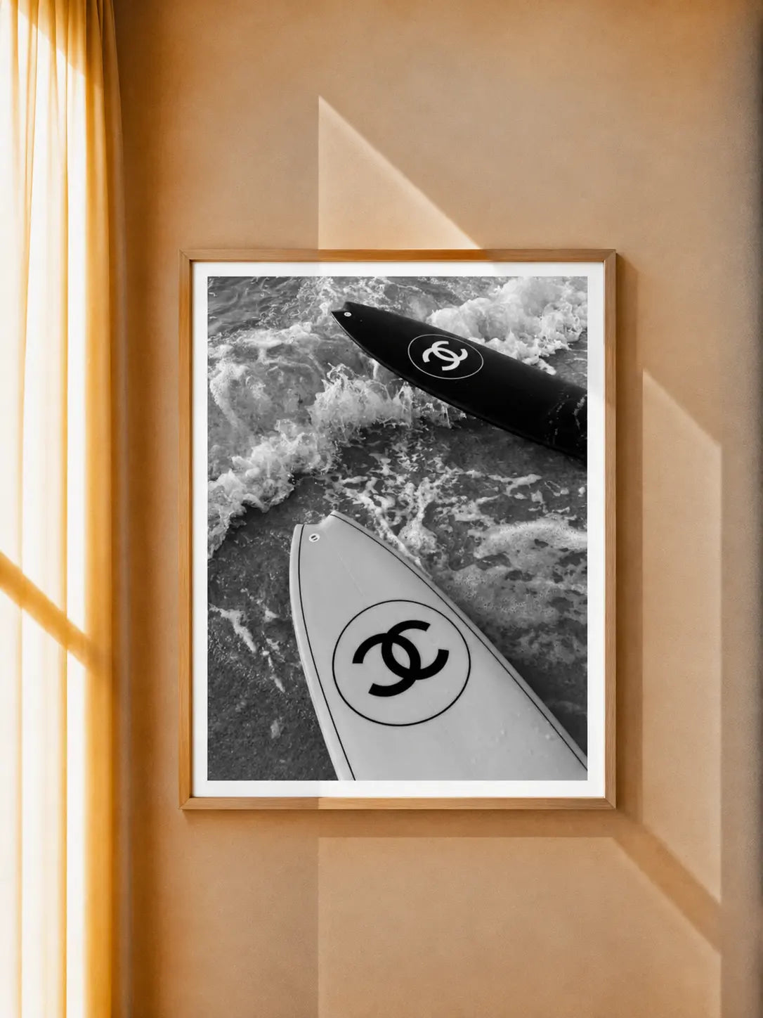 Surfboard photo art print in a light wood frame, black and light surfboards