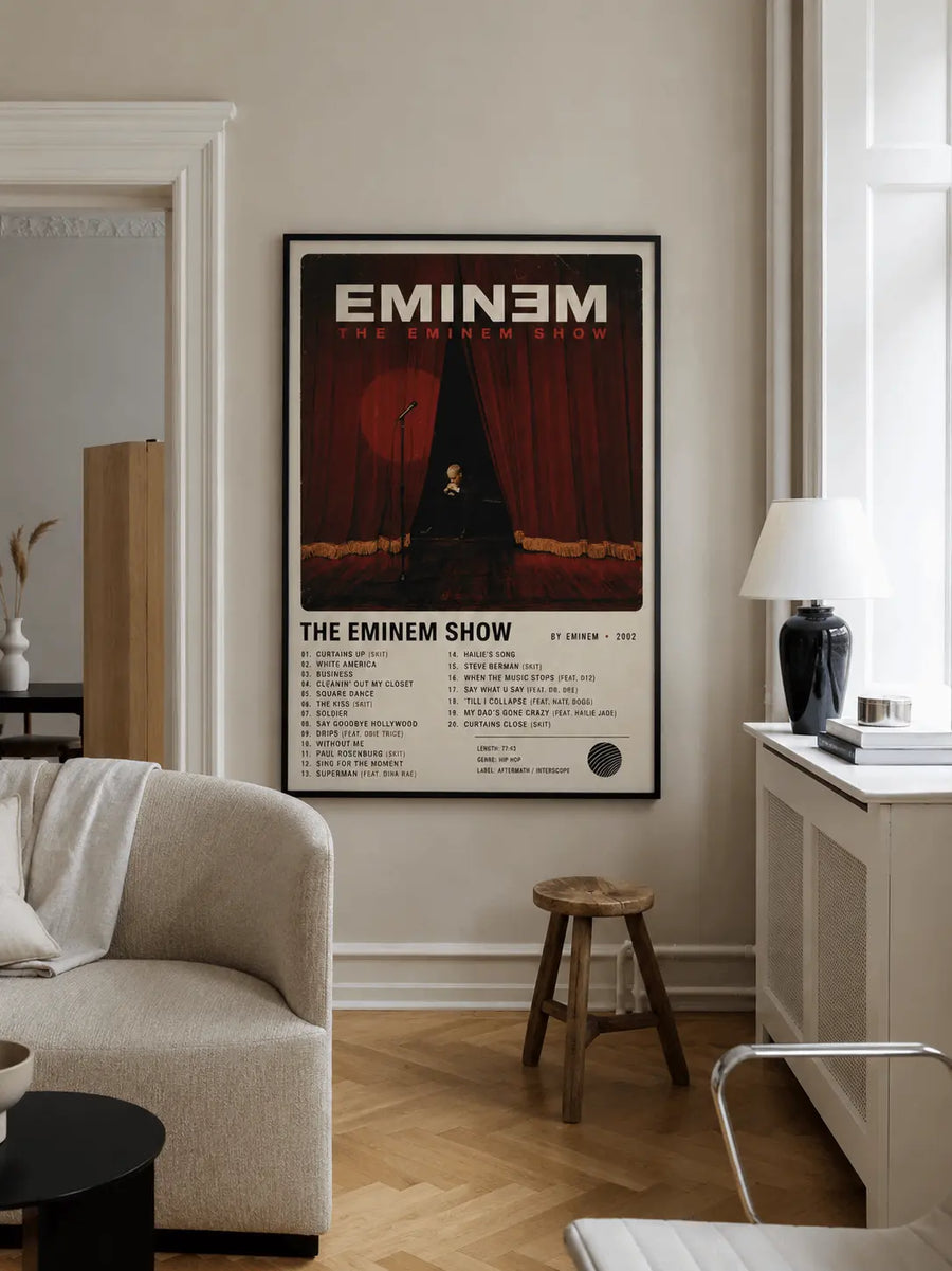 Framed rap music wall print with black border on wall above sofa