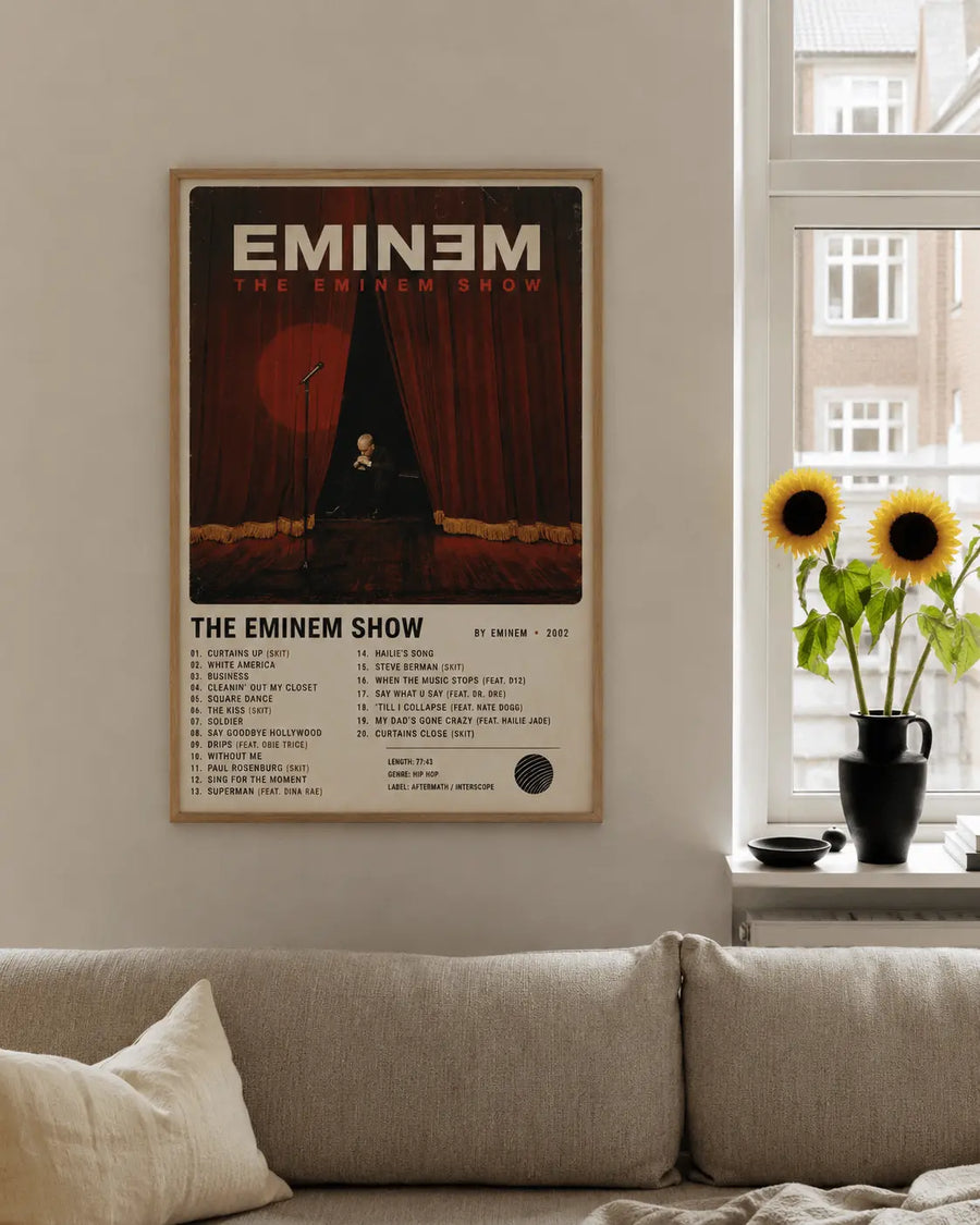 Framed rap music wall print with wood-tone border on living room wall, curtain artwork