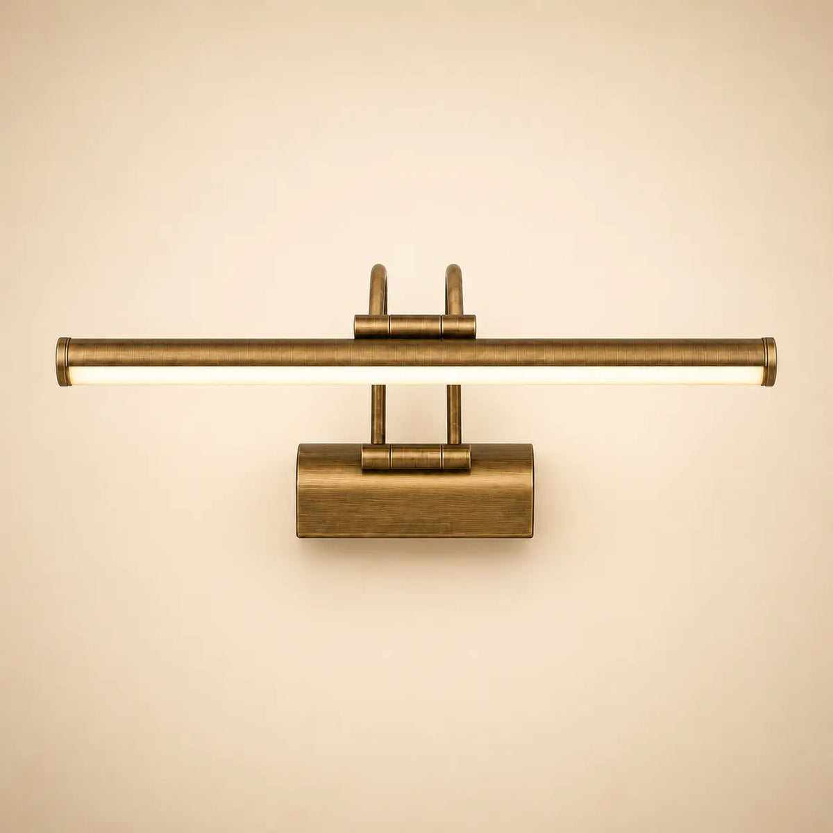 Gold metal wall light with long horizontal bar and central rectangular backplate