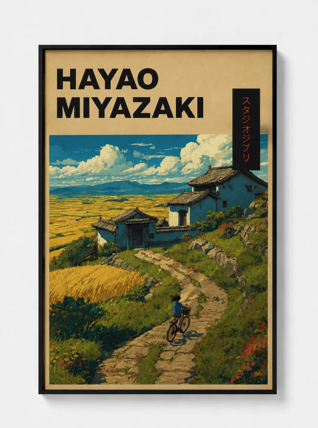 Framed Hayao Miyazaki art print showing countryside path, bicycle, and houses
