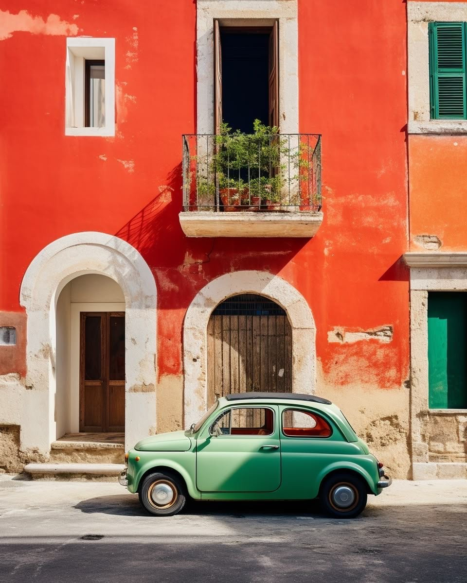 Vintage car-themed print showing a green classic car near arched orange building doors