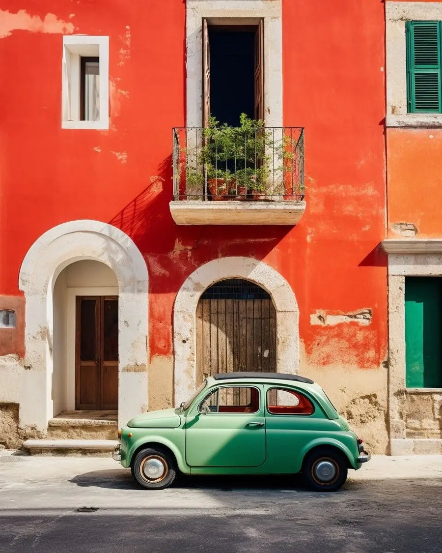 Vintage car-themed print showing a green classic car near arched orange building doors