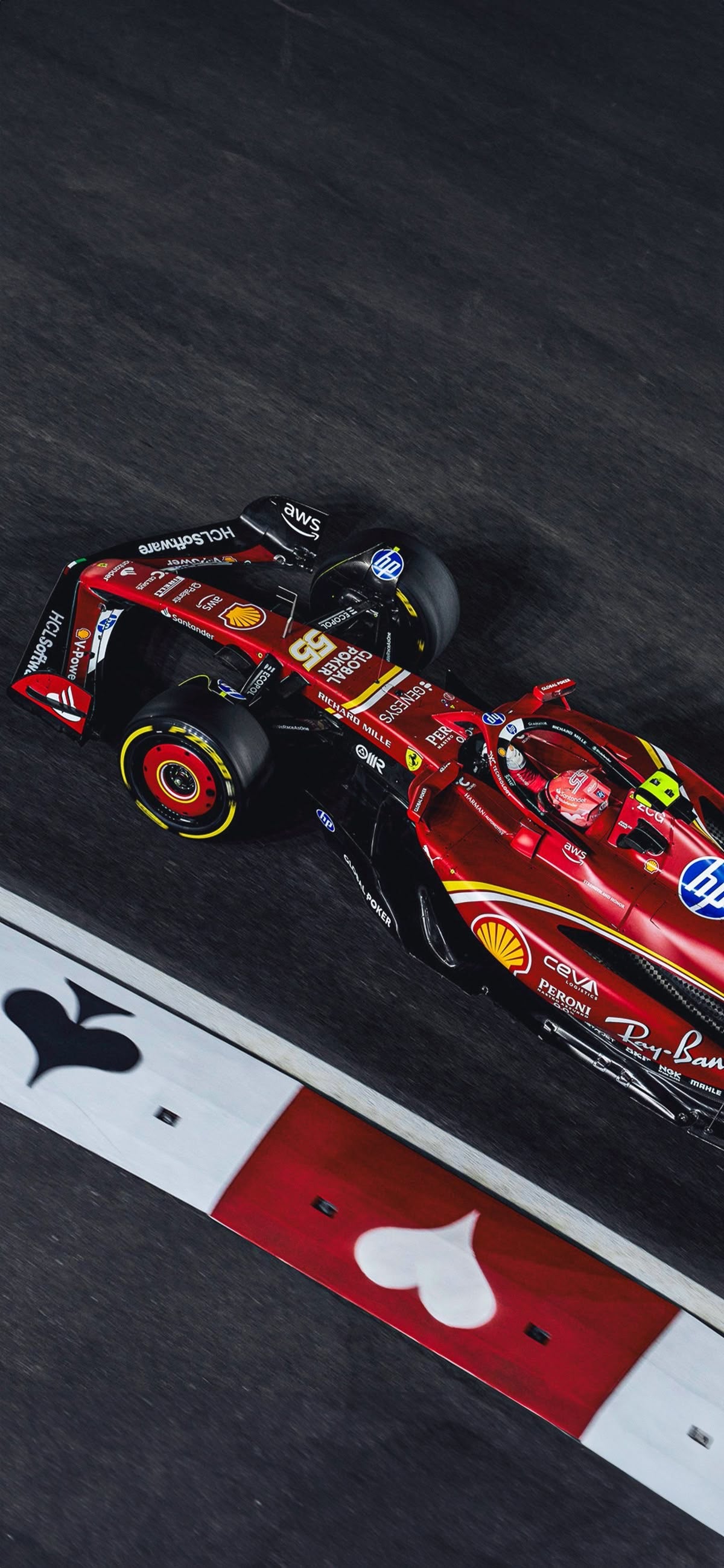 Modern Formula racing wall art showing a red race car speeding through a circuit from an aerial perspective.