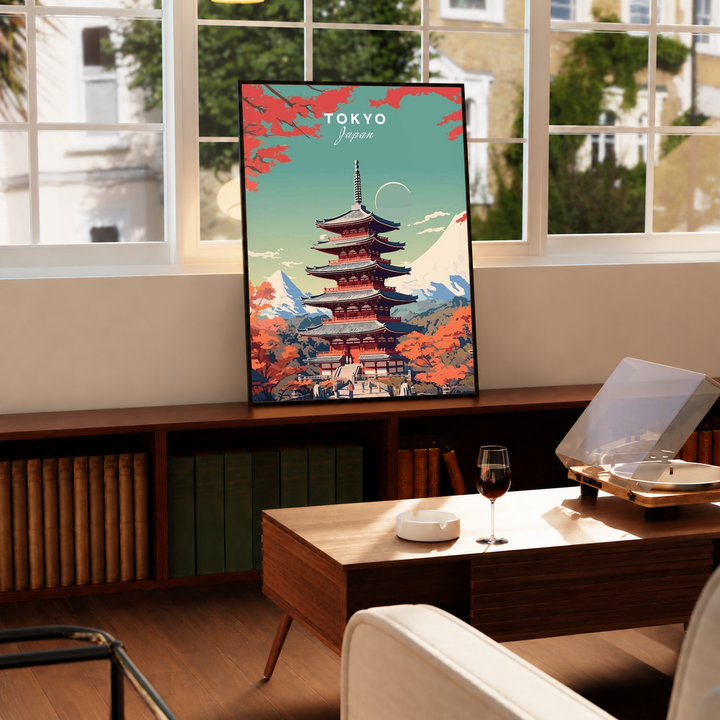 Japanese Pagoda Wall Art in a black frame beside a sunlit dining area, featuring a red tiered pagoda, orange autumn foliage and distant Mount Fuji beneath a turquoise sky.