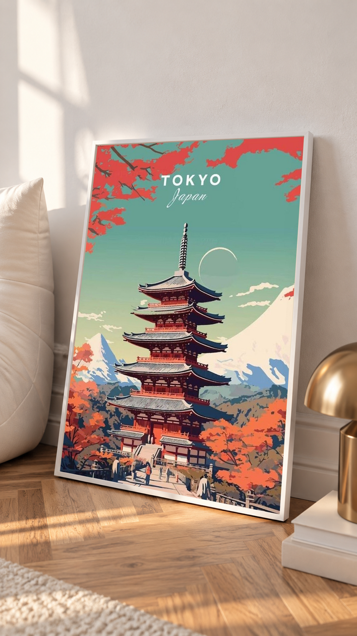 Japanese Pagoda Wall Art leaning against a pale wall on a sunlit wooden surface, showing a central red pagoda framed by autumn leaves against a turquoise sky with Mount Fuji behind.