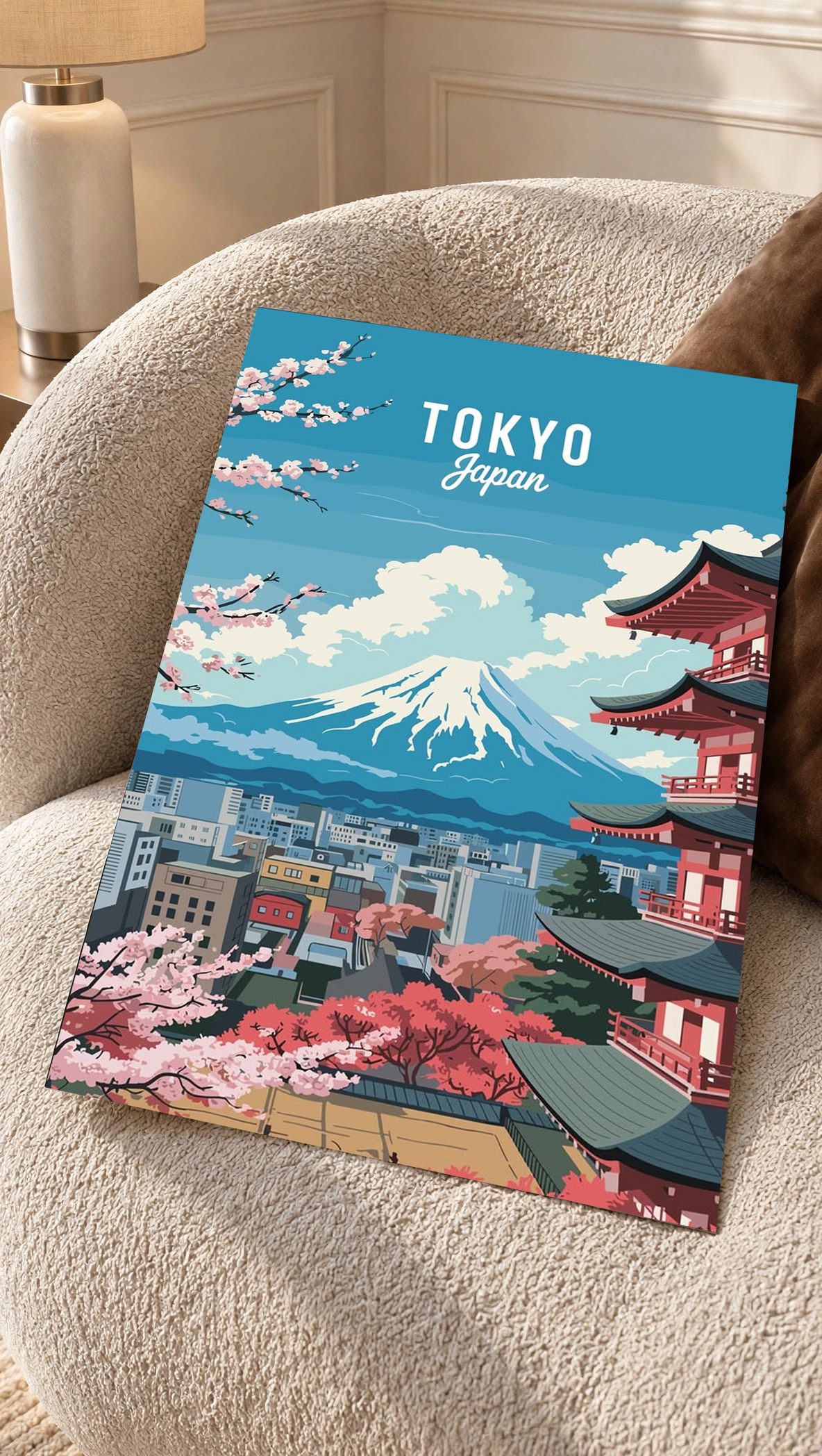 Wall art print on couch seat with blue Tokyo skyline, Mount Fuji, and cherry blossoms