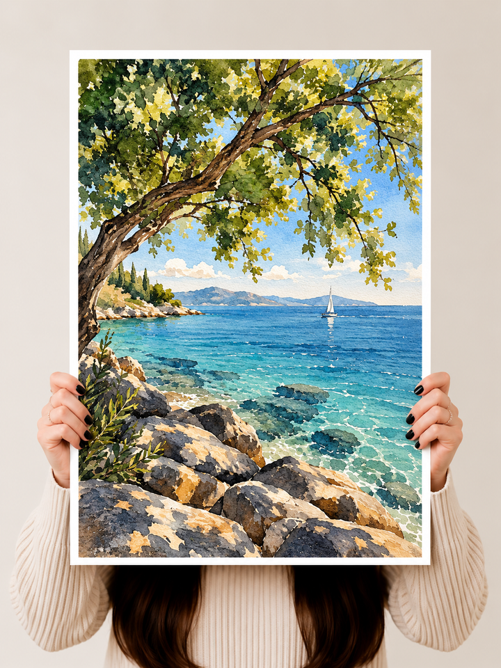 Mediterranean Coast Watercolor Art Print held upright to reveal rocky coastal textures, distant sailboats and layered blue washes