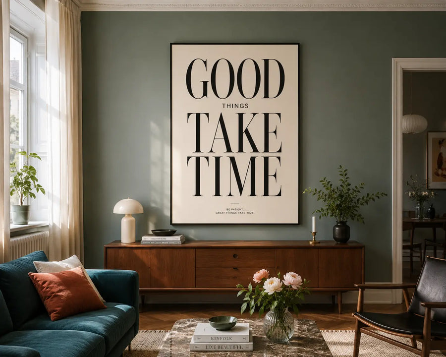 Black-framed wall print with “GOOD THINGS TAKE TIME” typography on cream background
