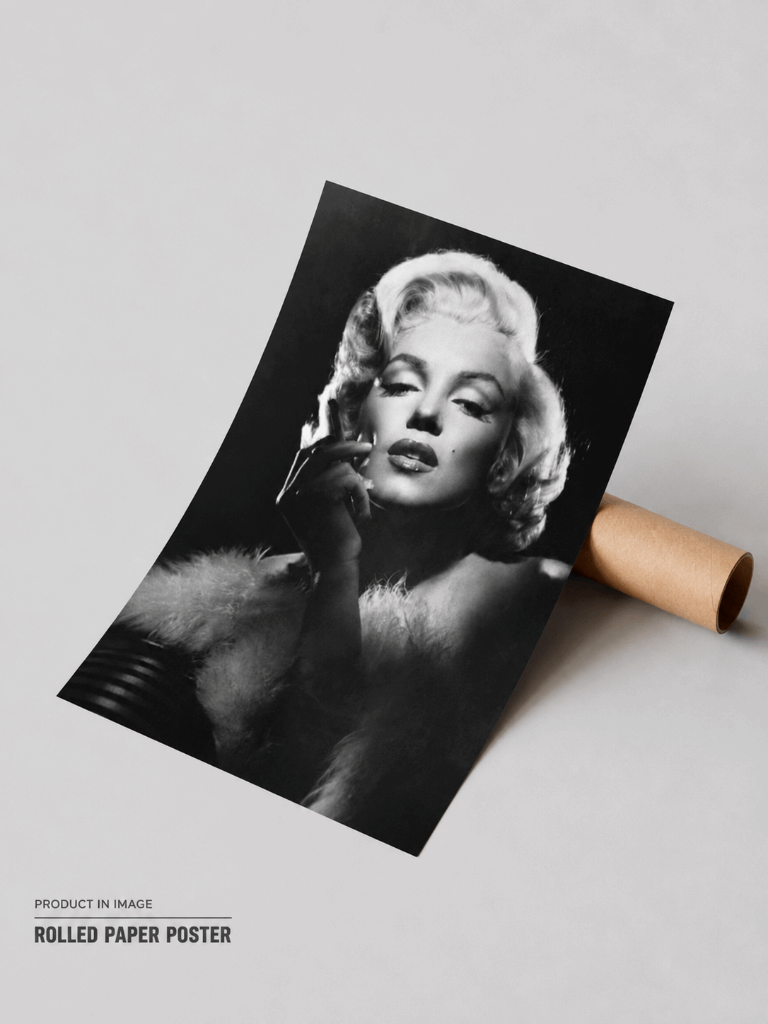 Rolled black-and-white Marilyn Monroe poster with portrait and hand near her face