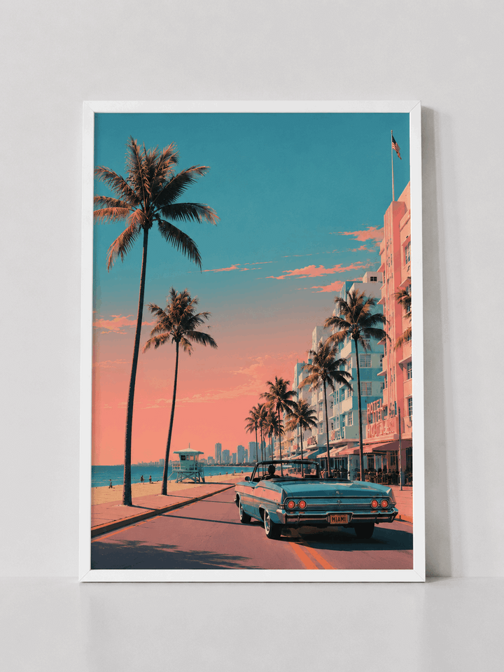 White-framed wall print featuring palm trees and pastel buildings with teal classic car